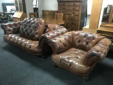 A brown button leather Chesterfield settee,