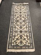 A Tabriz design runner on cream ground,