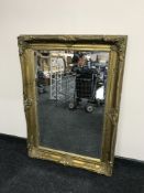An ornate gilt framed mirror