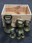 Six graduated brass weights