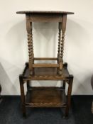An oak occasional table and oak serving trolley