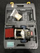 A cased Ryobi router with router bits