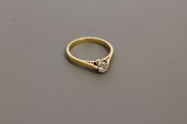 An 18ct gold diamond solitaire ring, approximately 0.25ct, size M.
