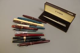 A collection of writing utencils to include; Parker '17' fountain pen,