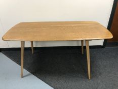 An Ercol elm dining table