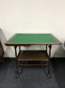 A mahogany foldover card table with gallery