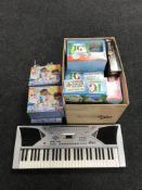A child's electric keyboard, nine Doc McStuffins jigsaws, assorted board games,