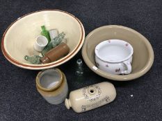 A chamber pot, stone ware bottles, glass bottles,