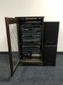 An oak audio cabinet continuing Aiwa hi/fi and speakers,