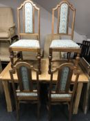 A set of four Edwardian oak dining chairs