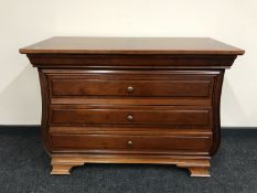 A three drawer chest in a mahogany finish CONDITION REPORT: 83cm high x 111cm wide