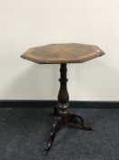 A Victorian mixed wood tilt topped pedestal table