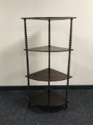 A mahogany four tier corner what not stand