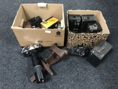 A box of assorted cameras and lenses - Zenit, Praktica Super TL, Olympus OM10,