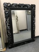 A black framed mirror, 94 cm x 120 cm.
