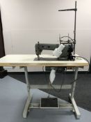 A Brother industrial treadle sewing machine in table
