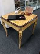 A contemporary gaming table fitted with roulette wheel, back gammon board,