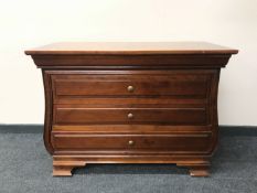 A three drawer chest in a mahogany finish CONDITION REPORT: 83cm high x 111cm wide