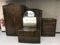 A mid 20th century oak four piece bedroom suite