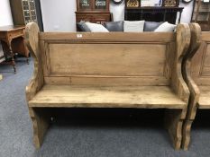 A reclaimed pine pew,