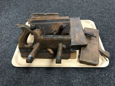 A tray of vintage wood working planes