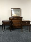 A five drawer dressing chest together with a pair of bedside stands (one handle missing)