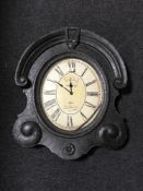 A black framed shaped cafe wall clock