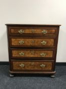 A late 19th century inlaid walnut four drawer chest