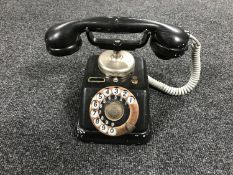 A vintage Danish metal telephone and hand set with brass dial