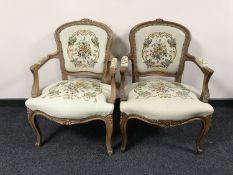 A pair of carved walnut framed armchairs