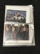 A folder containing a quantity of lobby cinema cards - Robert Fuller, Russell Crowe,