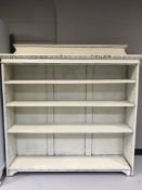 A set of painted oak open shelves