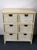 A contemporary six drawer wicker chest