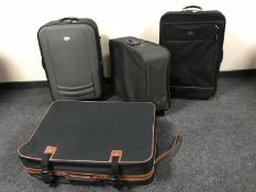 An Audi luggage case together with two Samsonite luggage cases and one other
