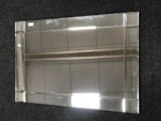 A contemporary un-framed mirror