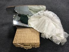A vintage wedding dress, two frameless mirrors,
