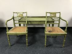 A pair of Regency style chinoiserie green and gilt cane seated armchairs and matching coffee table
