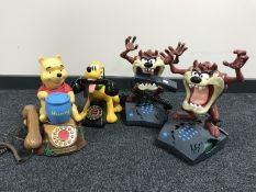 Four novelty telephones - Whinnie the Pooh, Pluto and two Tasmanian Devil.