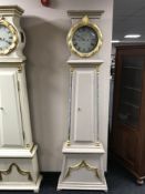 A painted long cased clock with enamelled dial by Andreas Holm dated 1858