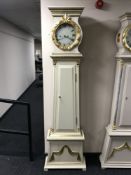 A painted long cased clock with enamelled dial