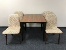 A 1970's teak flap sided dining table and four chairs
