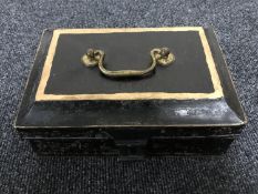 An antique metal spice box fitted with six containers