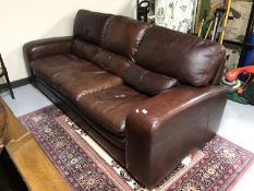 A Barker & Stonehouse brown leather three seater settee