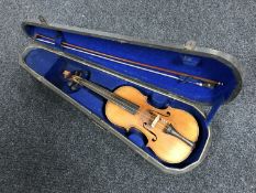 A twentieth century child's violin and bow in coffin case