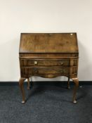 A walnut Queen Anne style bureau