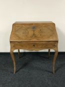 A 20th century French burr walnut bureau
