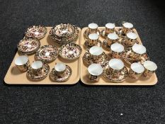Two trays of forty four pieces of Royal Crown Derby Imari pattern tea china,