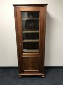 An early 20th century mahogany and pine display cabinet