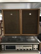 A Sanyo music system with teak cased speakers