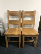 Four contemporary oak high back dining chairs